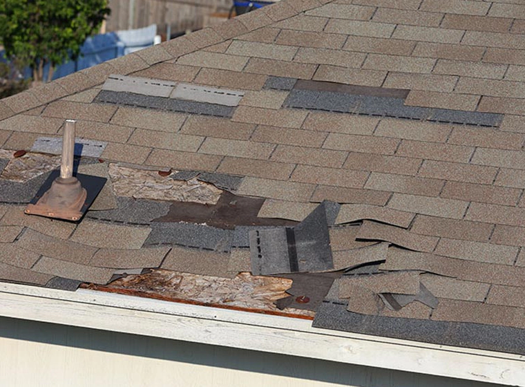 white house with grey and brown tiles